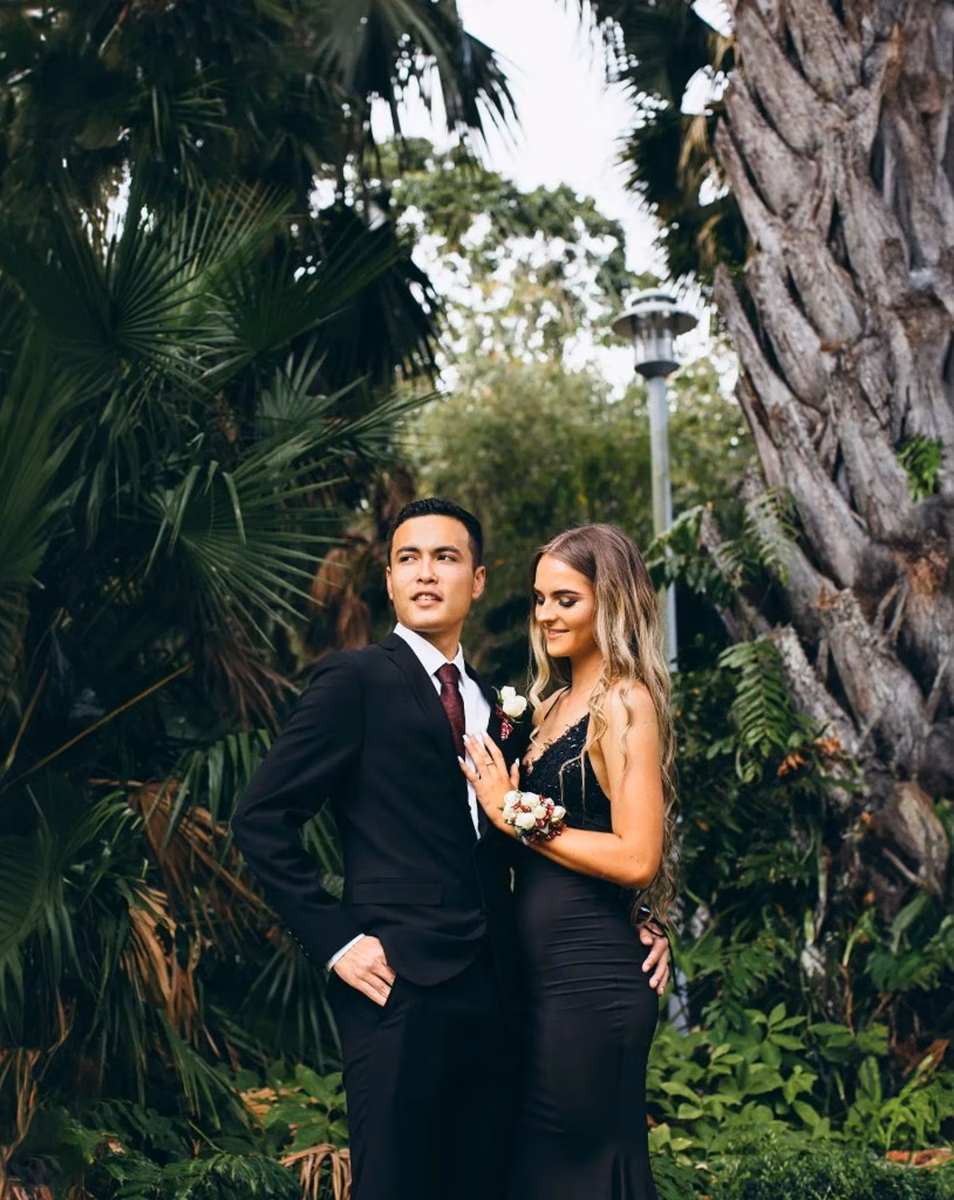 Couple in suit and dress in garden